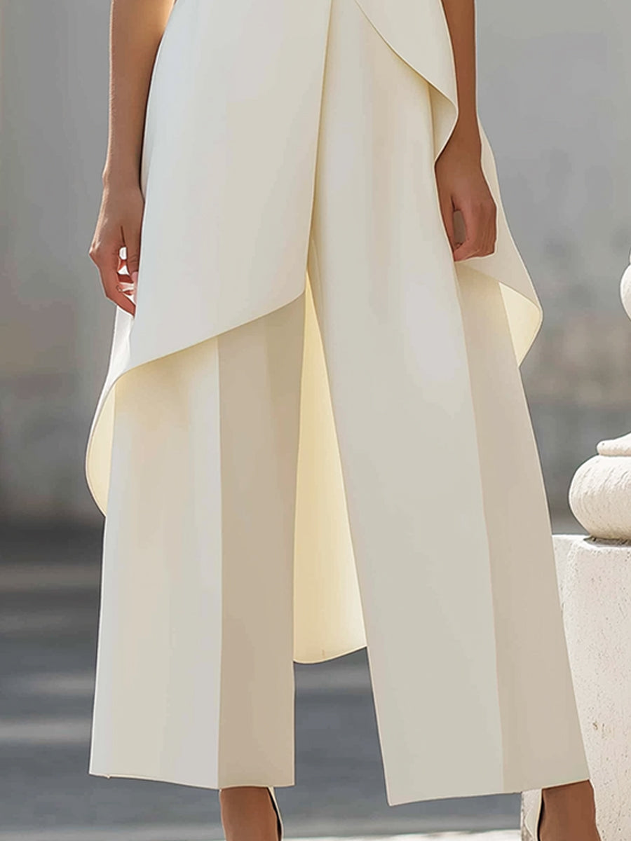 Group of friends at a ceremony, one wearing the sage green wide-leg jumpsuit, looking sophisticated.
