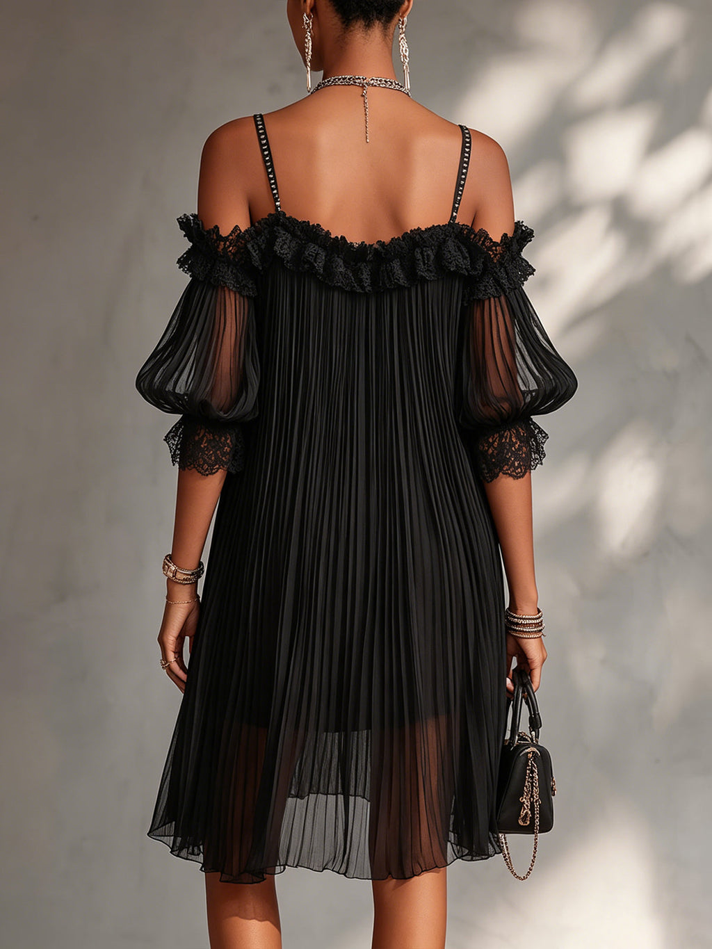 Woman wearing the black muslin off-shoulder mini dress in a stylish setting, demonstrating its flattering fit for an evening out.