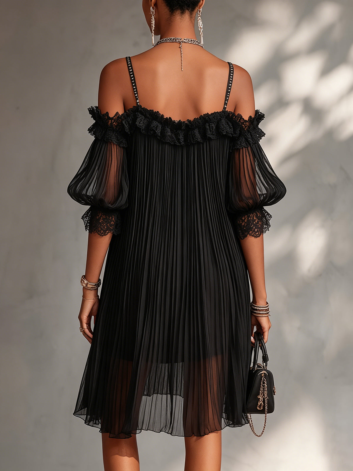 Woman wearing the black muslin off-shoulder mini dress in a stylish setting, demonstrating its flattering fit for an evening out.