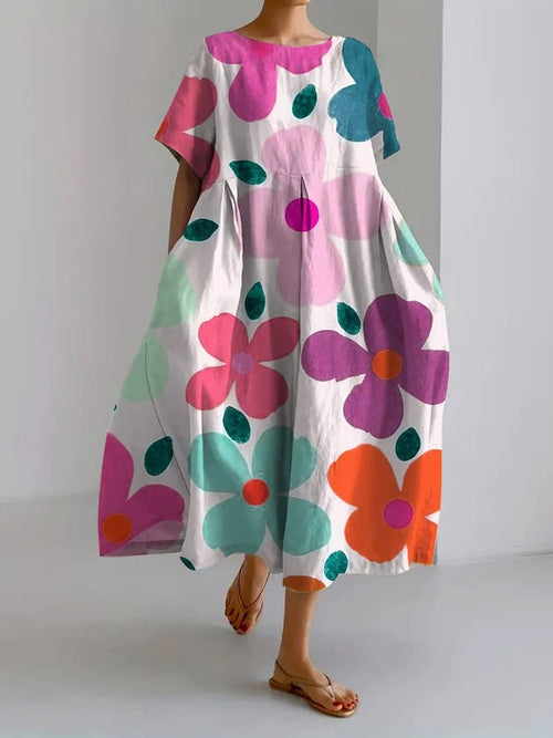 Close-up detail of the elegant floral print and soft ruffled sleeves on the lightweight summer dress.