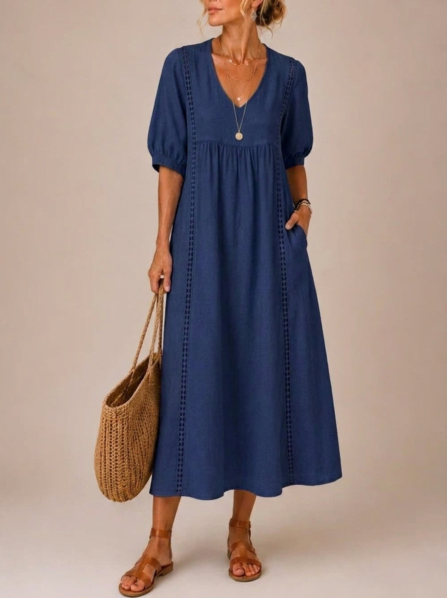 Detail shot focusing on the hemline and the overall flow of the lightweight summer midi dress, perfect for warm weather.