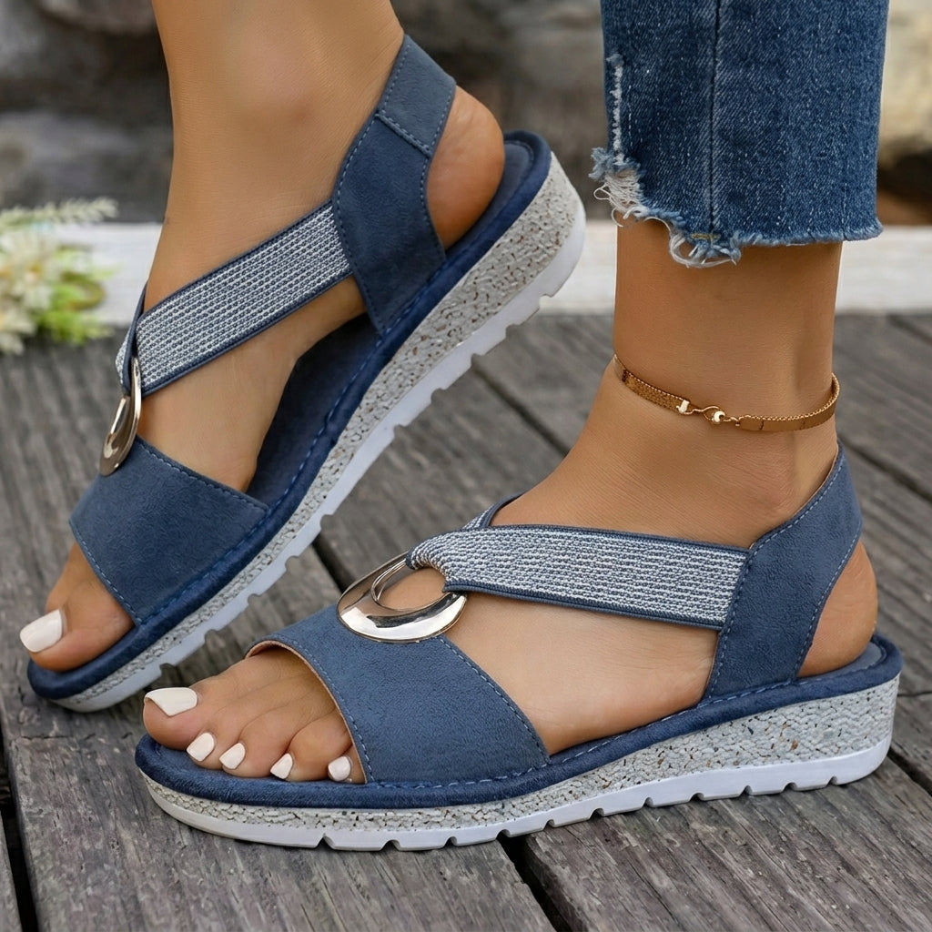 Back view of a pair of comfortable orthopedic sandals, focusing on the supportive sole structure.