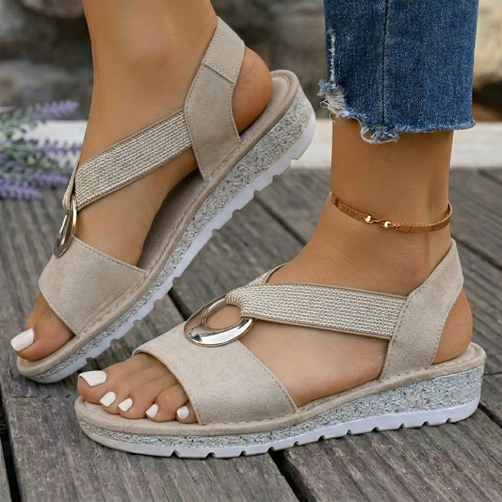 Overhead shot of khaki orthopedic sandals, emphasizing the foot-slimming design and flexible straps.