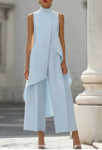 Close-up on the modern high-neck design of the sage green jumpsuit, showing fabric texture.