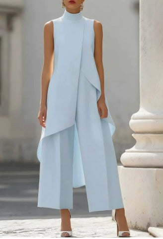 Close-up on the modern high-neck design of the sage green jumpsuit, showing fabric texture.