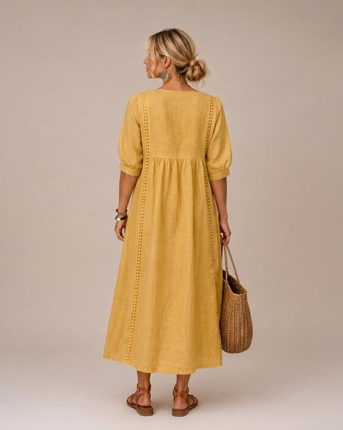 A collection of the midi dresses in various vibrant colors, neatly arranged to display their full range of hues.