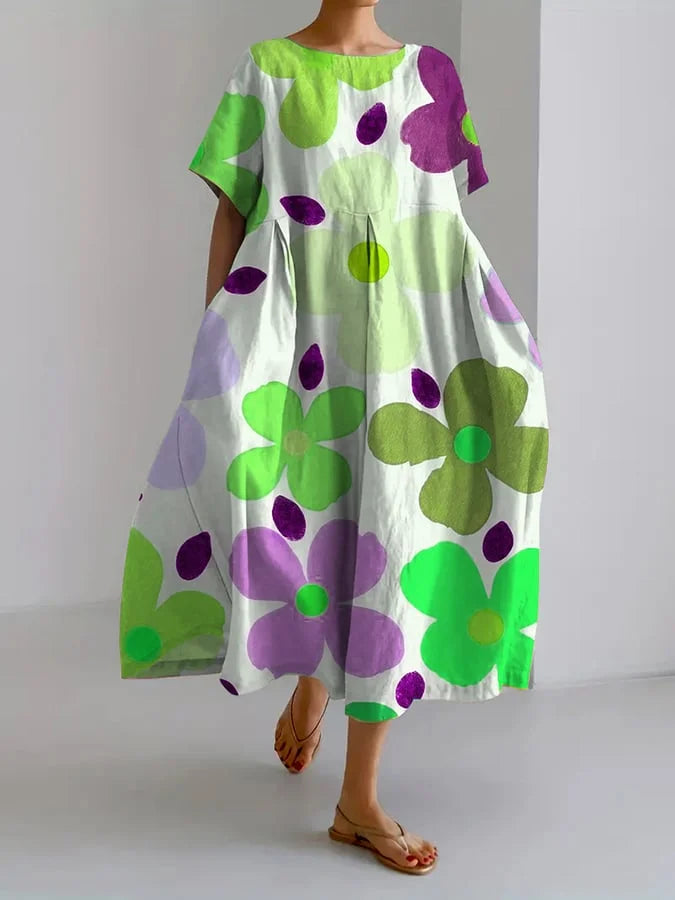 Back view of the elegant floral dress, highlighting the flowy skirt and lightweight feel perfect for warm weather.