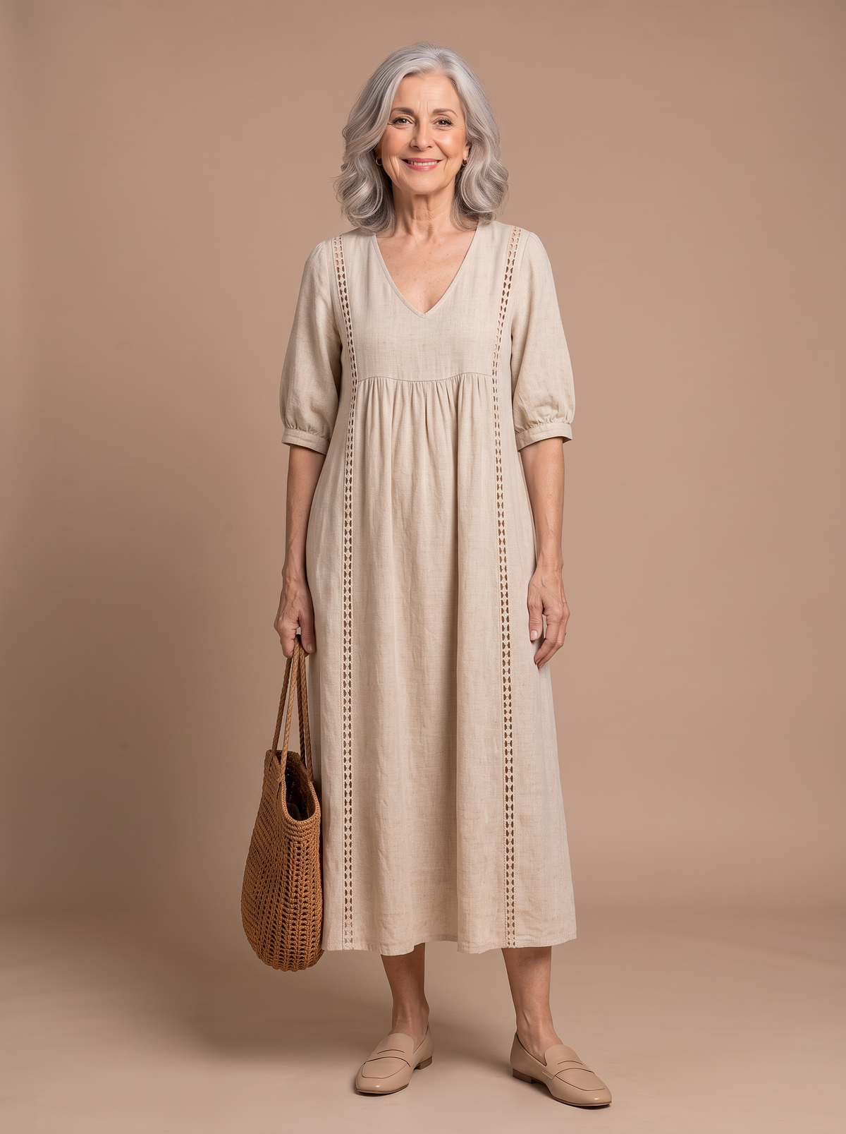 Lyra - Effortless Summer Midi Dress, model draagt de beige midi-jurk op warme beige studio-achtergrond